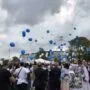Alla fine della cerimonia un lancio di palloncini per salutare Marco Tampwo